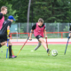 Beitragsbild Junior Camp 2020 abgesagt, 5 jugendliche Amputierten Fußballer beim Spiel auf einem Rasenplatz